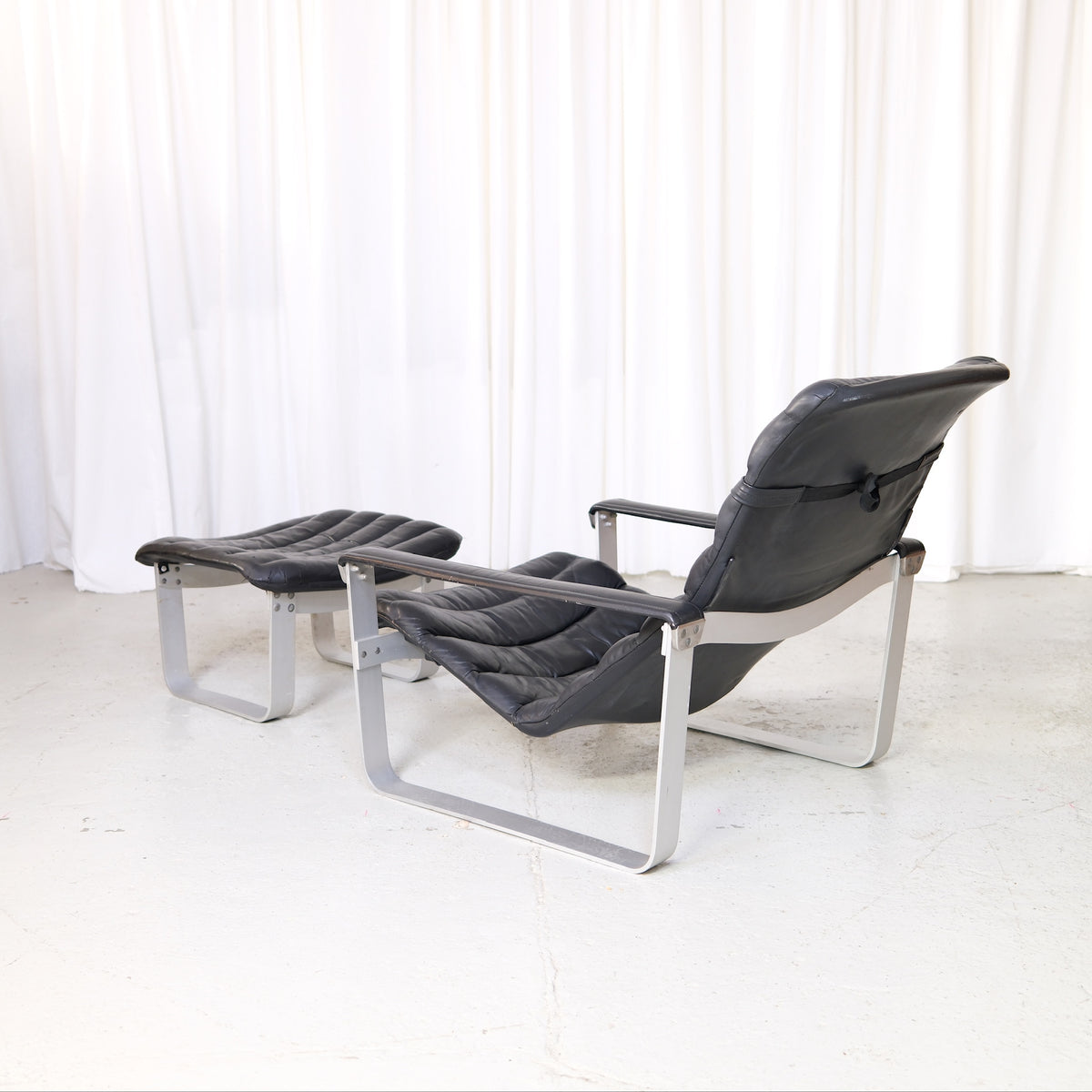 Ilmari Lappalainen Pulkka Lounge Chair with Ottoman in Black Leather