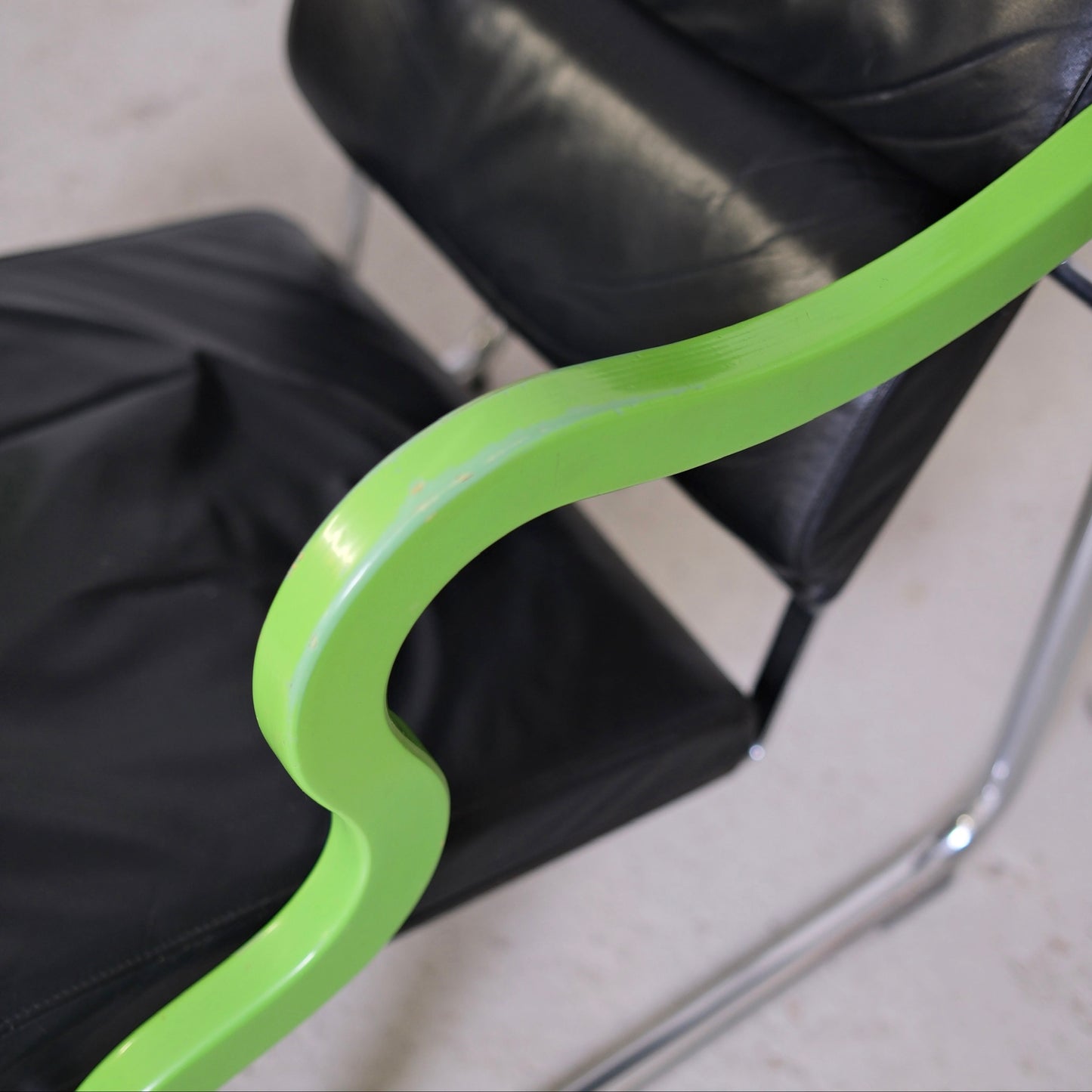 Yrjö Kukkapuro Experiment Lounge Chair in Black Leather and Green Armrests