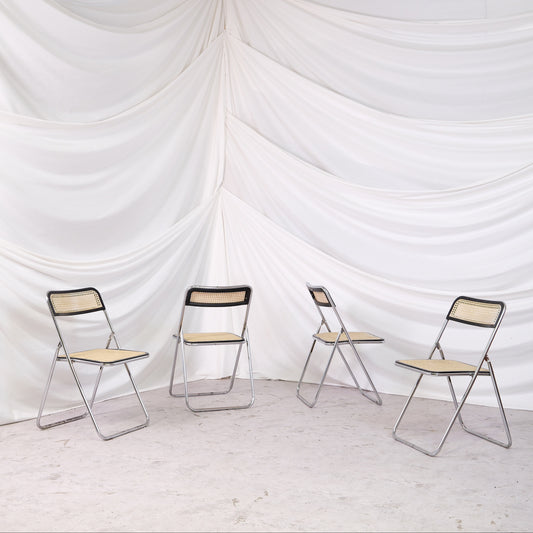 Vintage Unicanna Modulo 31 folding chair with chrome frame and cane seat and back. A practical and distinctive vintage folding chair.