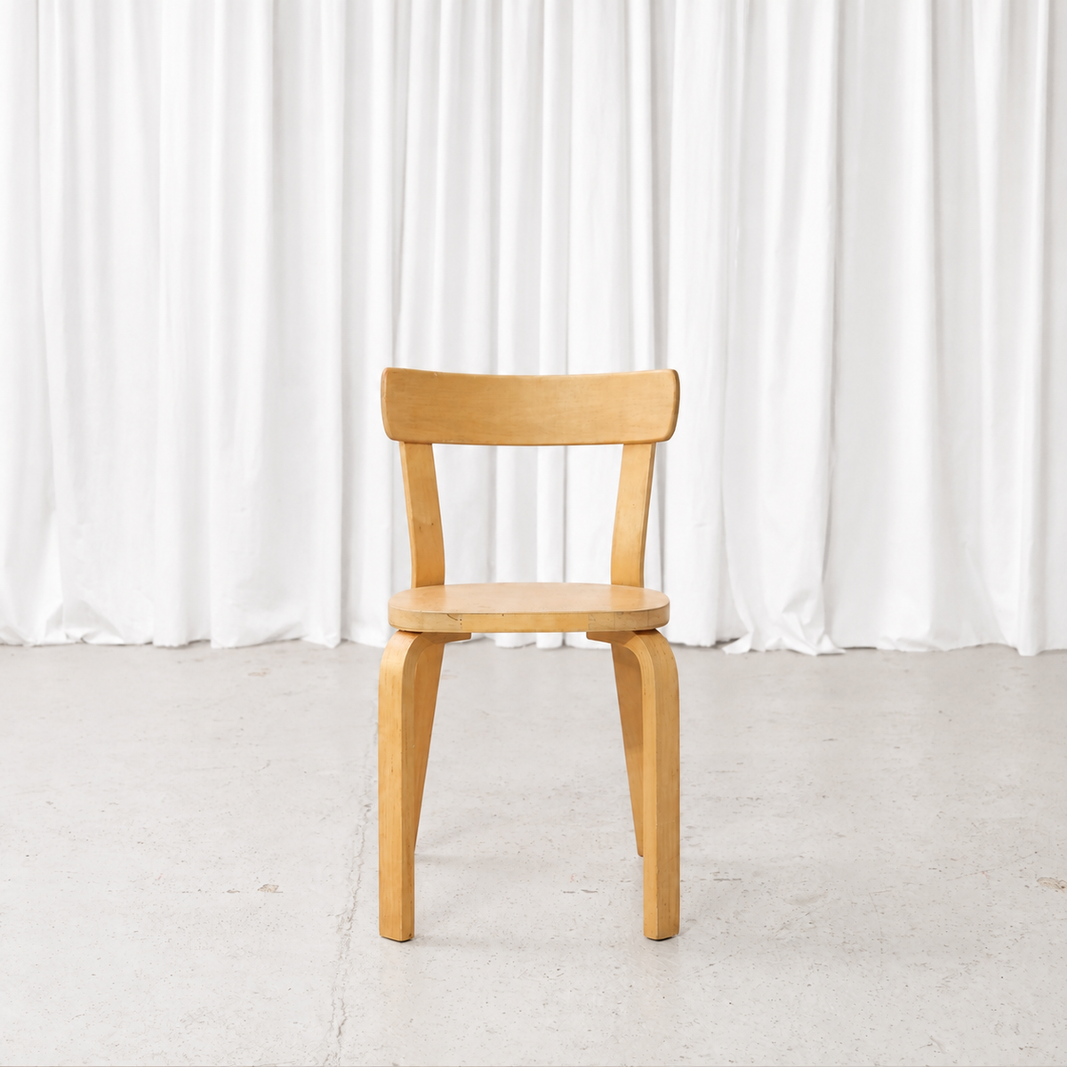 Front view of a 1950s Artek Chair 69 in birch